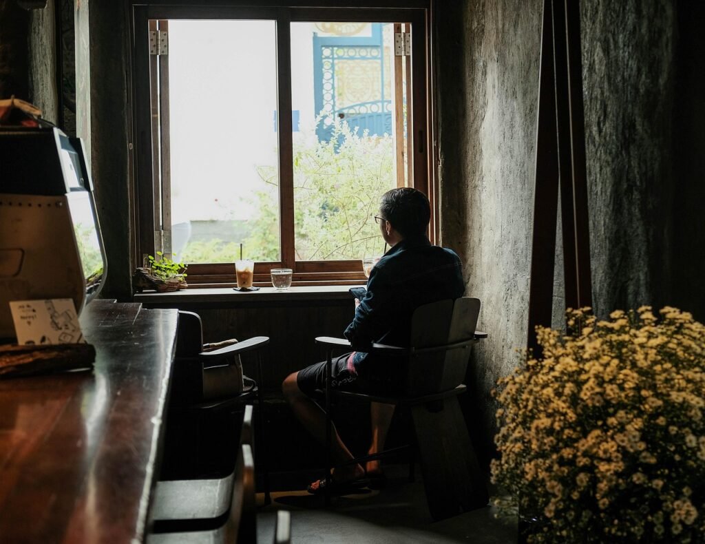 elderly person, looking out the window, home, relaxing, coffee time
